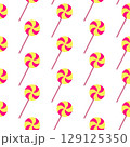 Spooky Halloween background with swirl lollipop in seamless style. Yellow festive lollipop repeated pattern for scary candy decor. Concept holiday design with sweet Halloween lollipop theme. Wrapping 129125350