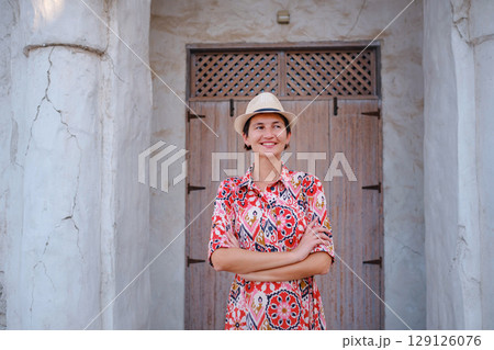 Young female tourist exploring iconic landmarks of the United Arab Emirates. 129126076