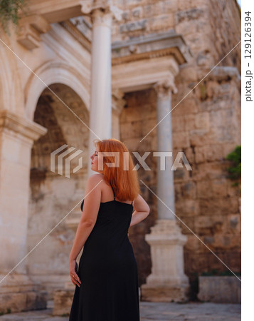 Young woman walking in old town, Antalya, Turkey 129126394