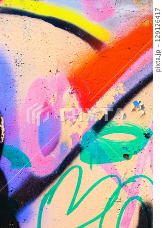 Vibrant Graffiti Art Wall with Neon Colors and Retro 90s Spray Paint Design 129126417