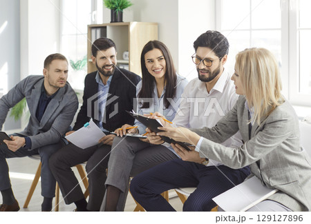 Business team of college friends discussing, brainstorming working online doing study project 129127896