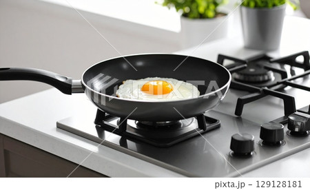 Fried egg in the pan on stove Fried egg in the pan on stove 129128181