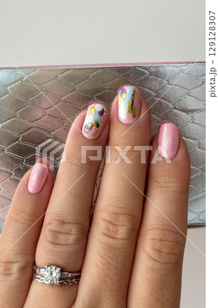 Elegant Hand with Modern Abstract Nail Art 129128307