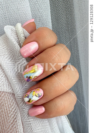 Elegant Hand with Modern Abstract Nail Art 129128308