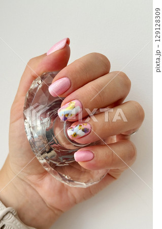 Elegant Hand with Modern Abstract Nail Art 129128309