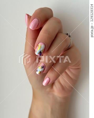 Elegant Hand with Modern Abstract Nail Art 129128314