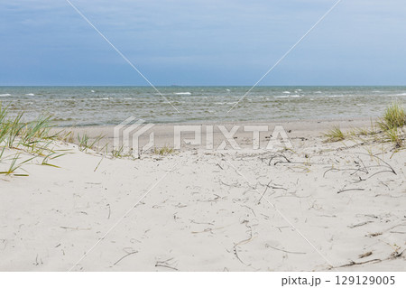 Pristine White Sand Dunes and Gentle Waves on Latvia Baltic Sea Coast Pristine White Sand Dunes and Gentle Waves on Latvia Baltic Sea Coast 129129005