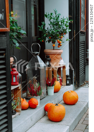 Autumn outdoor decor with pumpkins, citrus trees, and lanterns in Prague, october Autumn outdoor decor with pumpkins, citrus trees, and lanterns in Prague, october 129130407