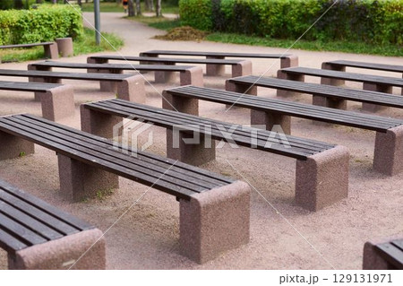 Aesthetic and Modern Outdoor Benches in a Tranquil Green Urban Park Setting for All Aesthetic and Modern Outdoor Benches in a Tranquil Green Urban Park Setting for All 129131971