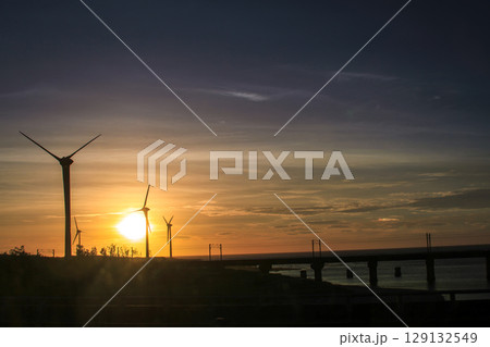 Sunset over the wind turbines and Longgang Harbor in Miaoli, Taiwan. Sunset over the wind turbines and Longgang Harbor in Miaoli, Taiwan. 129132549