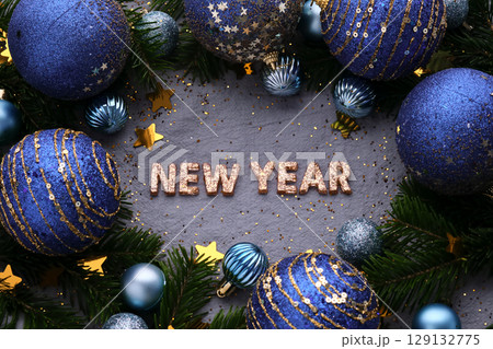 Abstract New Year blue background with Christmas decorations. 129132775