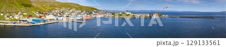 Fishing port Honningsvag Nordkapp with boats and colourful village 129133561