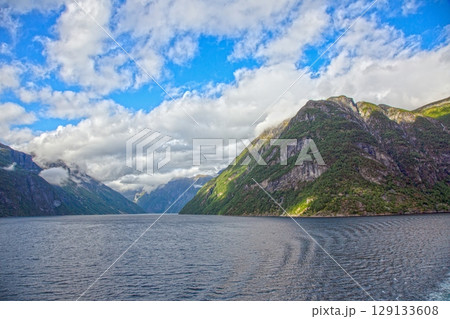 geirangerfjord wide fjord valley vista under cloudy sky 129133608