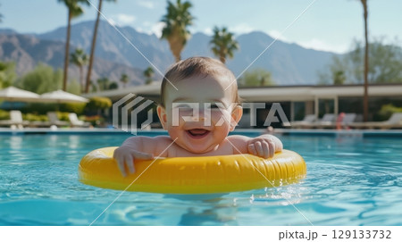 Joyful baby swimming 129133732