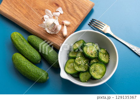 Fresh cucumber salad with dill and sesame seeds Fresh cucumber salad with dill and sesame seeds 129135367