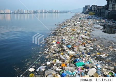 A large body of water is covered in plastic waste 129139331