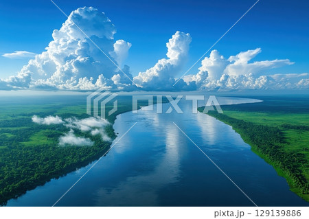 A beautiful blue river with a cloudy sky in the background 129139886