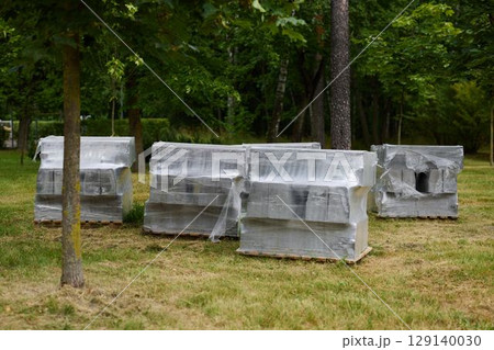 Wrapped Items are Strategically Stored in a Park Setting for Optimal Space Utilization Wrapped Items are Strategically Stored in a Park Setting for Optimal Space Utilization 129140030
