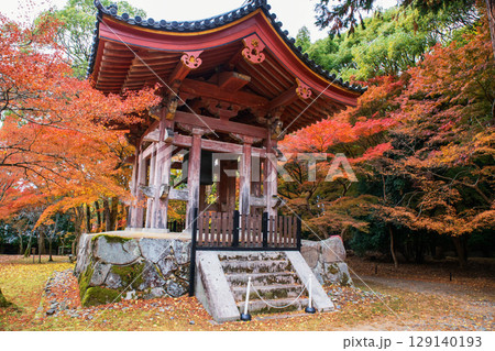 Bell tower by colorful autumn maple leaf in Daigoji temple,Kyoto 129140193