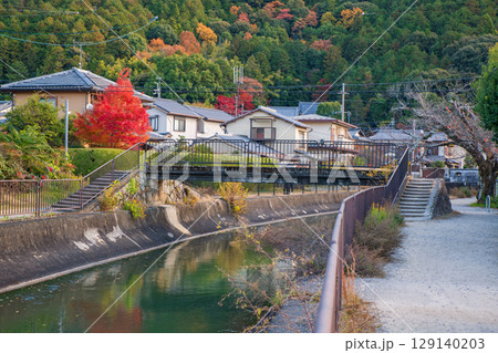 Japanese houses by lake Biwa canal with autumn colors, Kyoto Japanese houses by lake Biwa canal with autumn colors, Kyoto 129140203