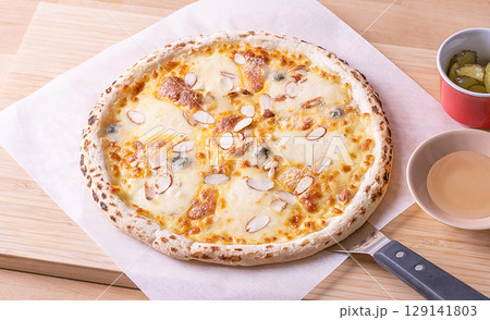 pizza on wooden background pizza on wooden background 129141803
