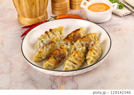 Japanese fried Gyoza stuffed dumplings 129142340