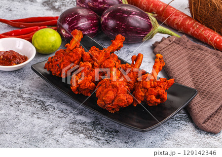 Indian cuisine - spicy Chicken lollipop Indian cuisine - spicy Chicken lollipop 129142346