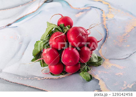 Raw fresh ripe radish root 129142458