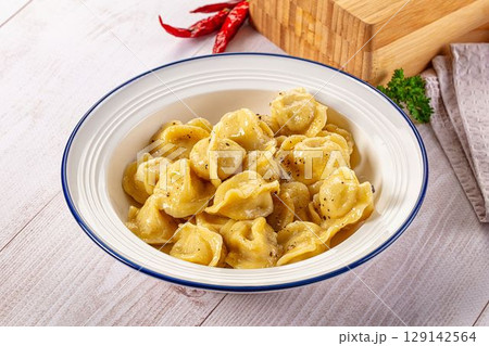 Tasty Russian dumplings with meat 129142564