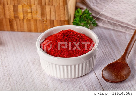 Red dry chili pepper paprika powder 129142565