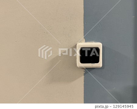 A doorbell on a beige-blue background in a new building. High quality photo A doorbell on a beige-blue background in a new building. High quality photo 129145945