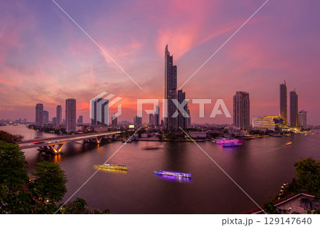 Chao Phraya River under sunset sky, twilight, view from top of Bangkok building. 129147640