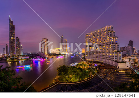 Chao Phraya River under sunset sky, twilight, view from top of Bangkok building. 129147641