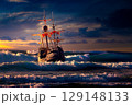 Grand view of an old sailing ship from the times of pirates on the high seas with big waves 129148133