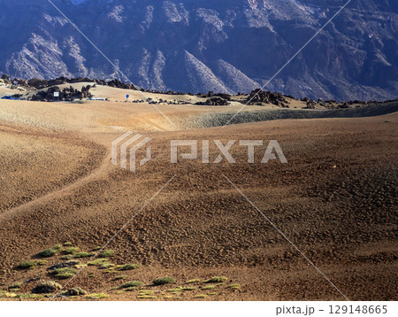 Volcano landscape with desert among mountains. Volcano landscape with desert among mountains. 129148665