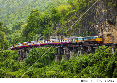 Train running on the death railway River Kwai in Kanchanaburi, Thailand. Train running on the death railway River Kwai in Kanchanaburi, Thailand. 129151233