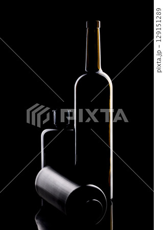 Still life with glass objects on a black background 129151289