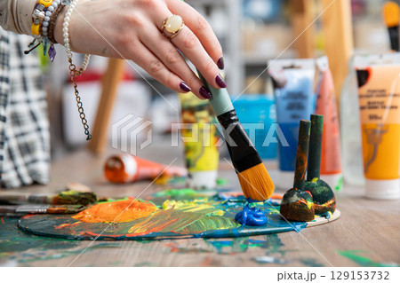 Engaging in Artistic Creativity Utilizing Paint and Brushes Within a Dedicated Studio Setting Engaging in Artistic Creativity Utilizing Paint and Brushes Within a Dedicated Studio Setting 129153732