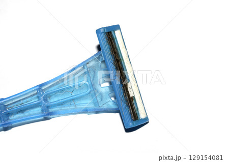 Close up of a used shaving razor on white background 129154081