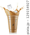 Splash iced coffee with milk and ice in disposable glass isolated on white background 129154927