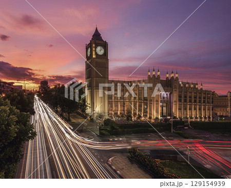 Big Ben and Car light trails against colorful sunset in London, England, UK. Big Ben and Car light trails against colorful sunset in London, England, UK. 129154939