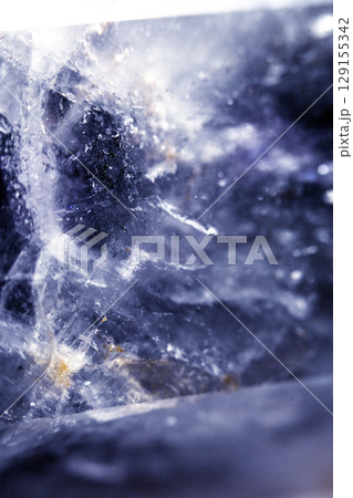 Beautiful close up of quartz crystal rock shard with reflective rainbow spiritual light 129155342