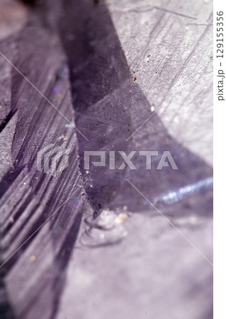 Beautiful close up of quartz crystal rock shard with reflective rainbow spiritual light Beautiful close up of quartz crystal rock shard with reflective rainbow spiritual light 129155356