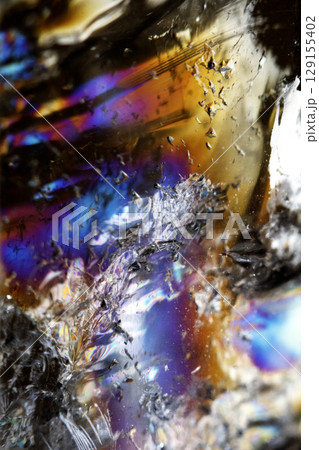 Beautiful close up of quartz crystal rock shard with reflective rainbow Holographic spiritual light Beautiful close up of quartz crystal rock shard with reflective rainbow Holographic spiritual light 129155402