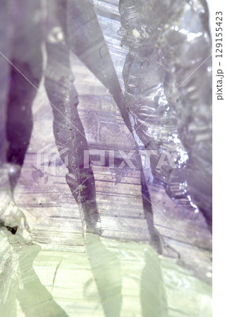 Beautiful close up of quartz crystal rock shard with reflective rainbow spiritual light Beautiful close up of quartz crystal rock shard with reflective rainbow spiritual light 129155423