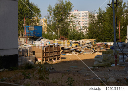 An Urban Construction Site That Is Enveloped by Beautiful and Lush Greenery All Around 129155544