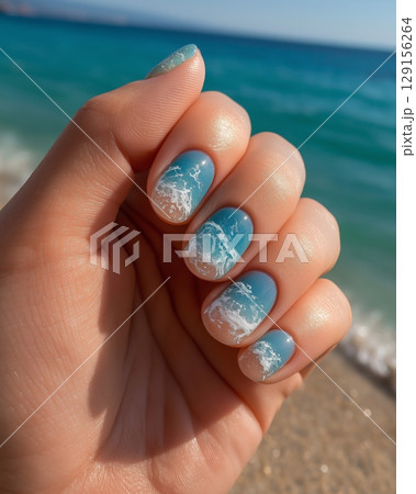 Colorful ocean wave nail art at the beach on a sunny day 129156264