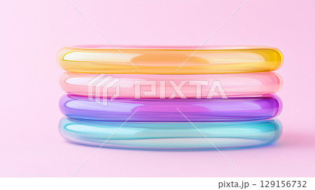 Colorful glossy rings on pink background for modern art display and decor Colorful glossy rings on pink background for modern art display and decor 129156732