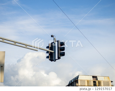 Traffic light above the road against the sky. Road traffic concept. Prohibited traffic light signal. 129157017