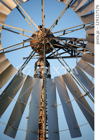 windmill used for regulationof water flow in agriculture as water pump 129157576